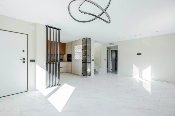 Modern living room with open kitchen and minimalist decor